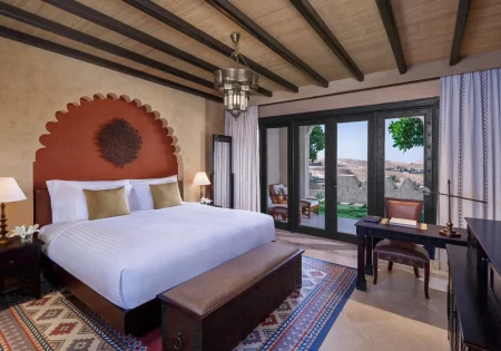 qasr al sarab desert resort by anantara guest room deluxe garden room king bed 1920x1037